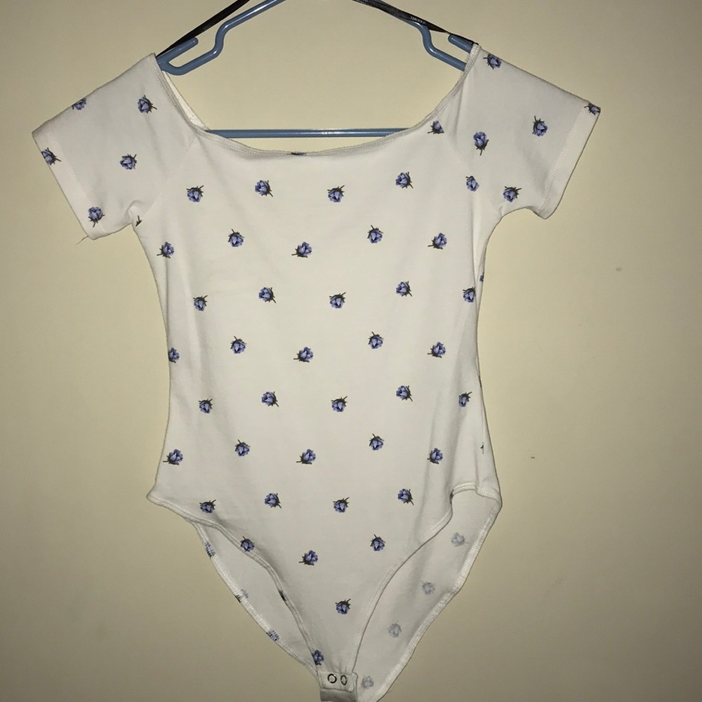 A white bodysuit with blue flowers